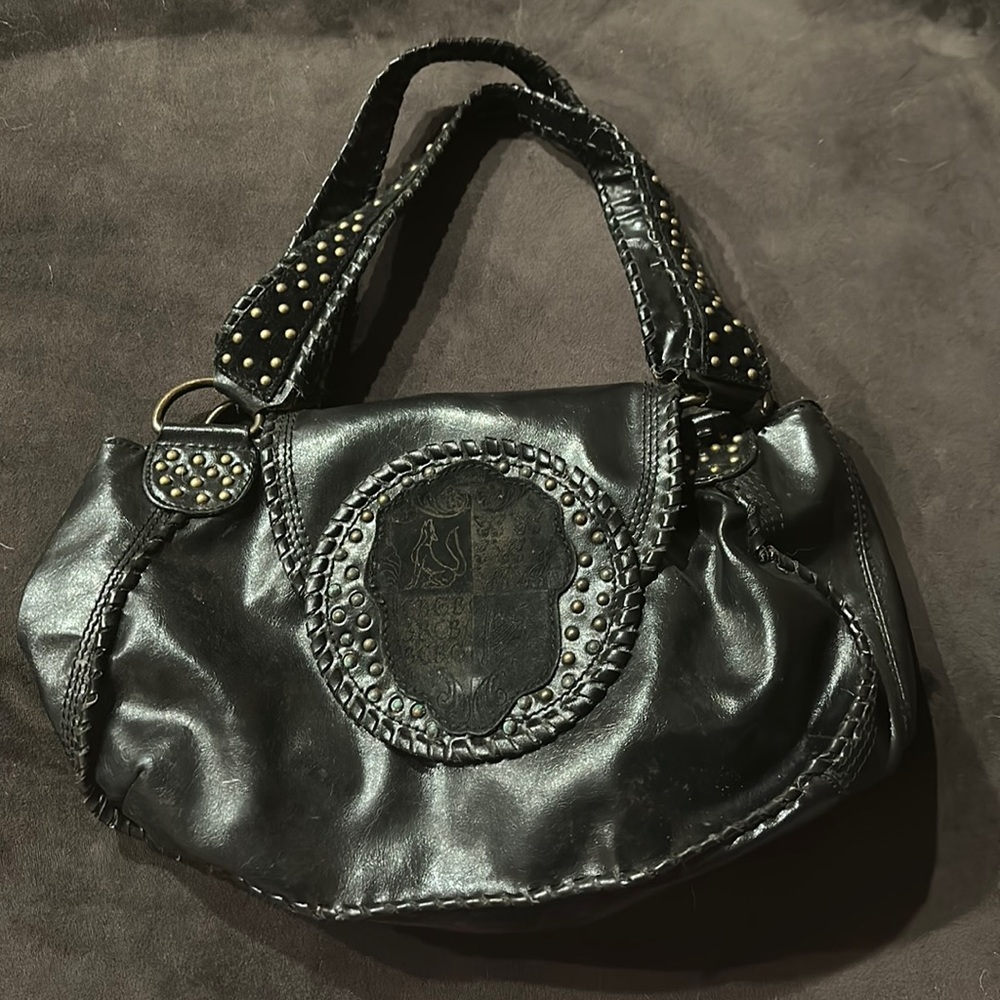 BCBGirls black leather gold studded purse BCBG shield emblem purple interior